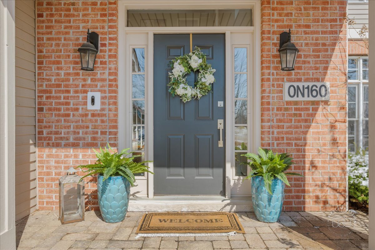 N160 Yates Place Geneva, IL 60134 - Photo 4 of 30 a potted plant sitting in front of a door