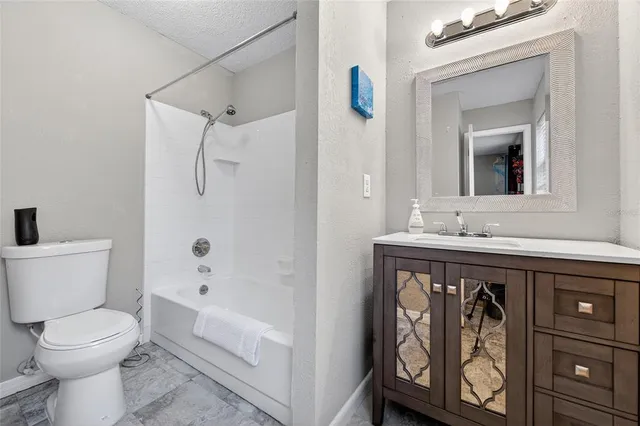 a bathroom with a sink a toilet and a bathtub