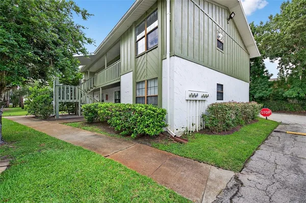 a view of a house with a yard