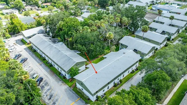 an aerial view of a house with outdoor space and street view