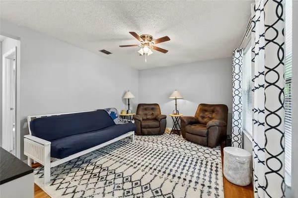 a living room with furniture and a rug