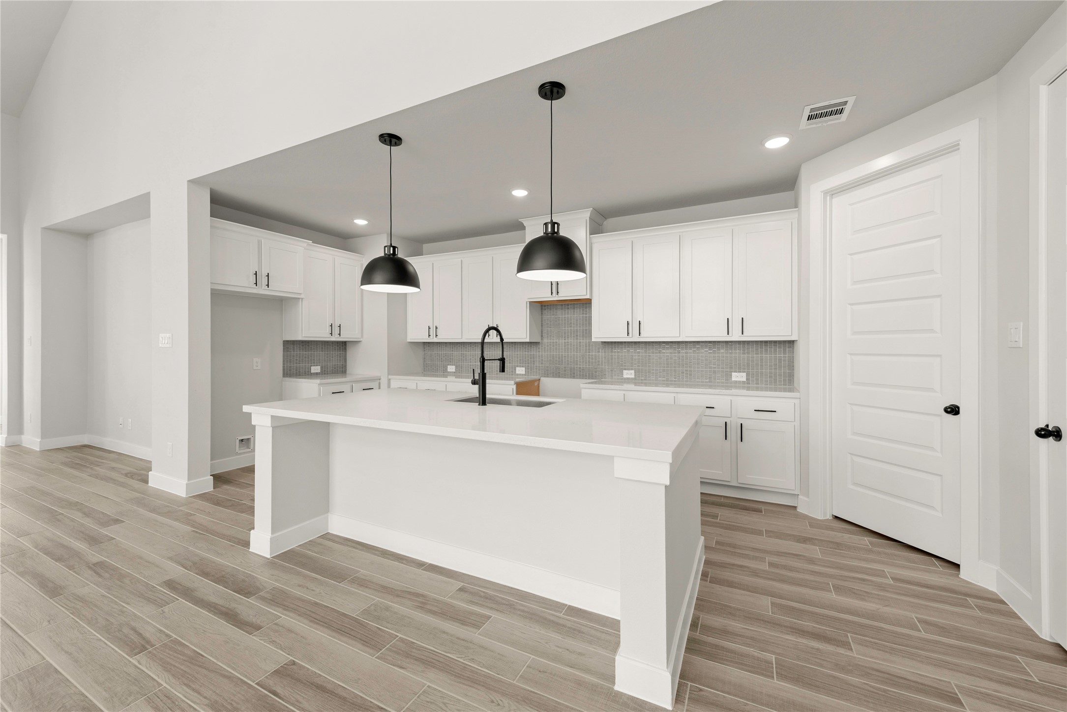 10950 Middle Rdg Drive Missouri City, TX 77459 - Photo 6 of 21 a kitchen with kitchen island a sink stainless steel appliances and cabinets