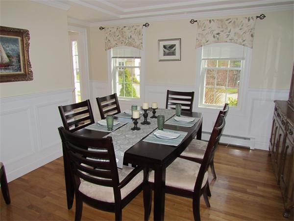 52 Vista Circle Rutland, MA 01543 - Photo 10 of 30 a view of a dining room with furniture window and wooden floor
