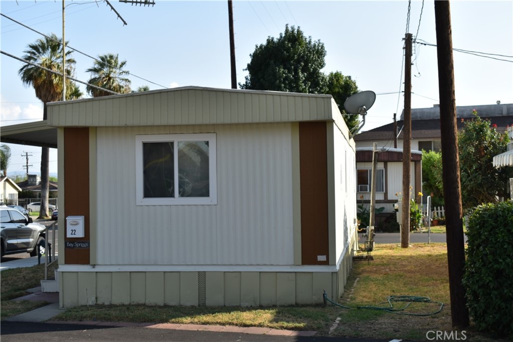 3661 Pacific Avenue, Unit 22 Jurupa Valley, CA 92509 - Photo 2 of 32 a view of a house with a porch