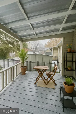 a view of a garden with wooden fence