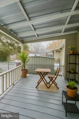 a view of a garden with wooden fence