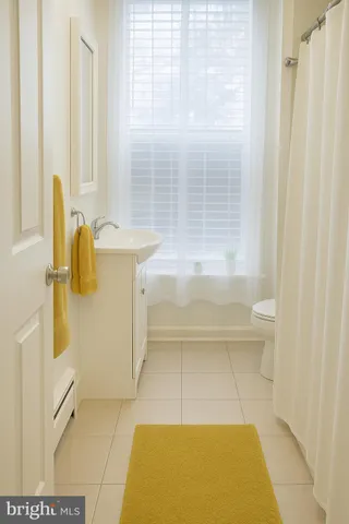 a bedroom with a bed and flat screen tv