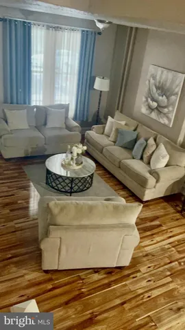a living room with furniture and a table