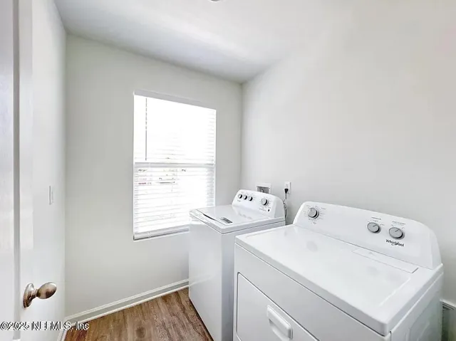 a utility room with dryer and washer
