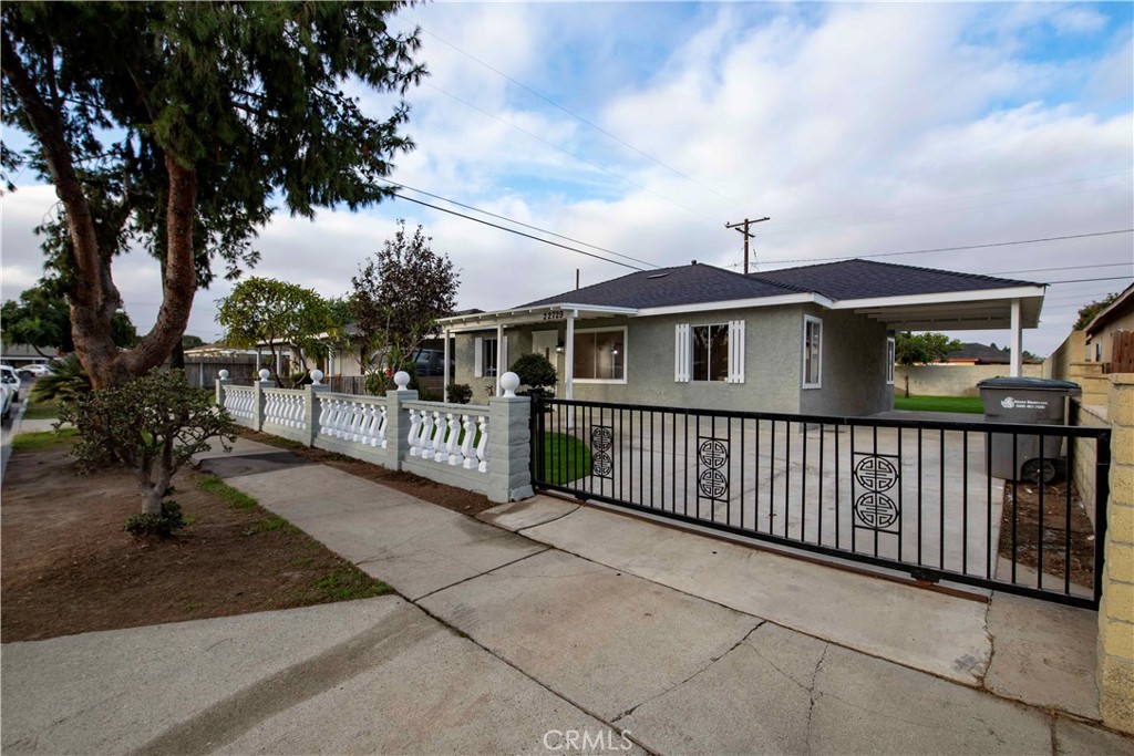 22729 Marbella Avenue Carson, CA 90745 - Photo 14 of 57 a view of a house with a wooden fence