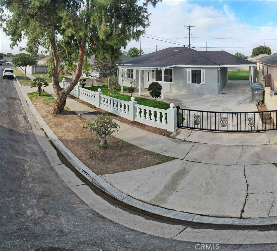22729 Marbella Avenue Carson, CA 90745 - Photo 15 of 57 a view of a house with a yard and deck
