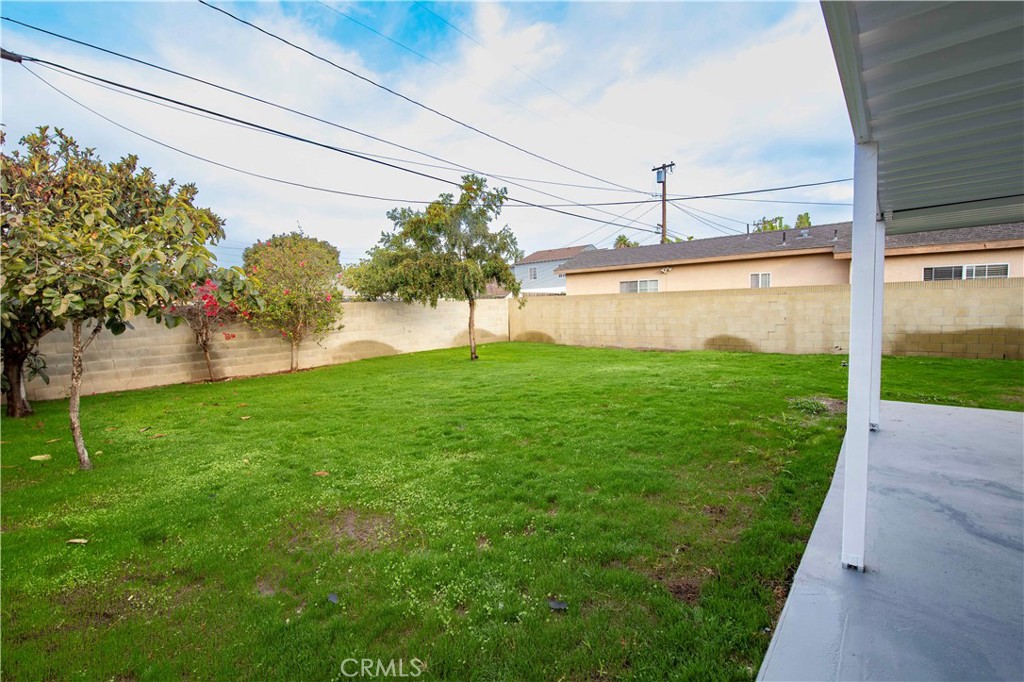 22729 Marbella Avenue Carson, CA 90745 - Photo 25 of 57 a view of a backyard with plants and a bench