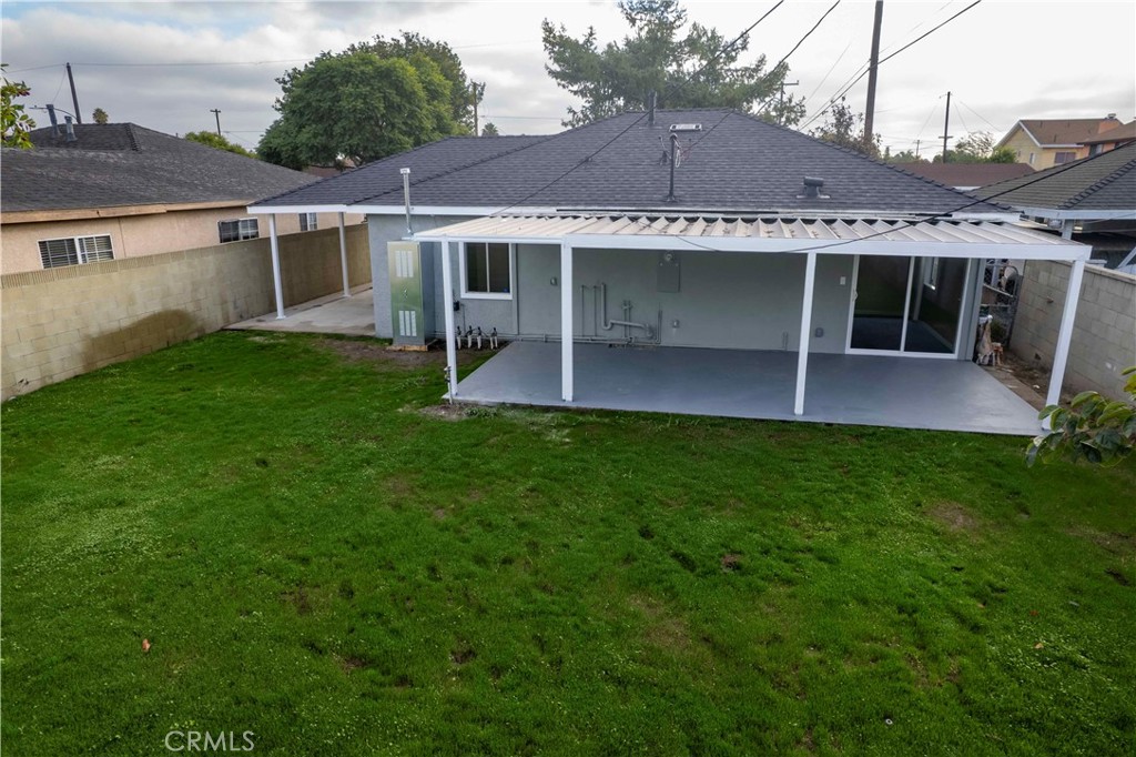 22729 Marbella Avenue Carson, CA 90745 - Photo 26 of 57 a view of a house with a yard and a porch