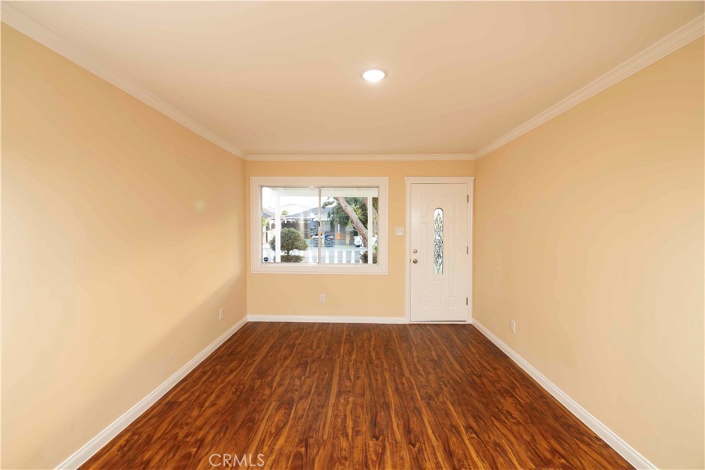 22729 Marbella Avenue Carson, CA 90745 - Photo 30 of 57 a view of an empty room with wooden floor and a window