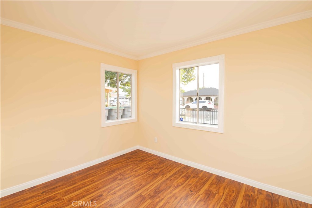 22729 Marbella Avenue Carson, CA 90745 - Photo 35 of 57 a view of an empty room with wooden floor and a window
