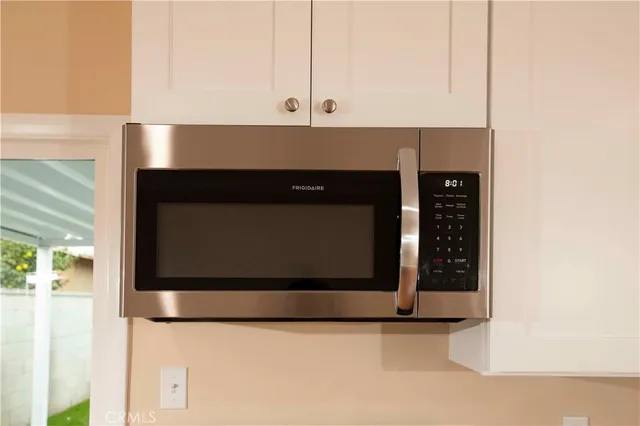 a view of counter space and wooden floor