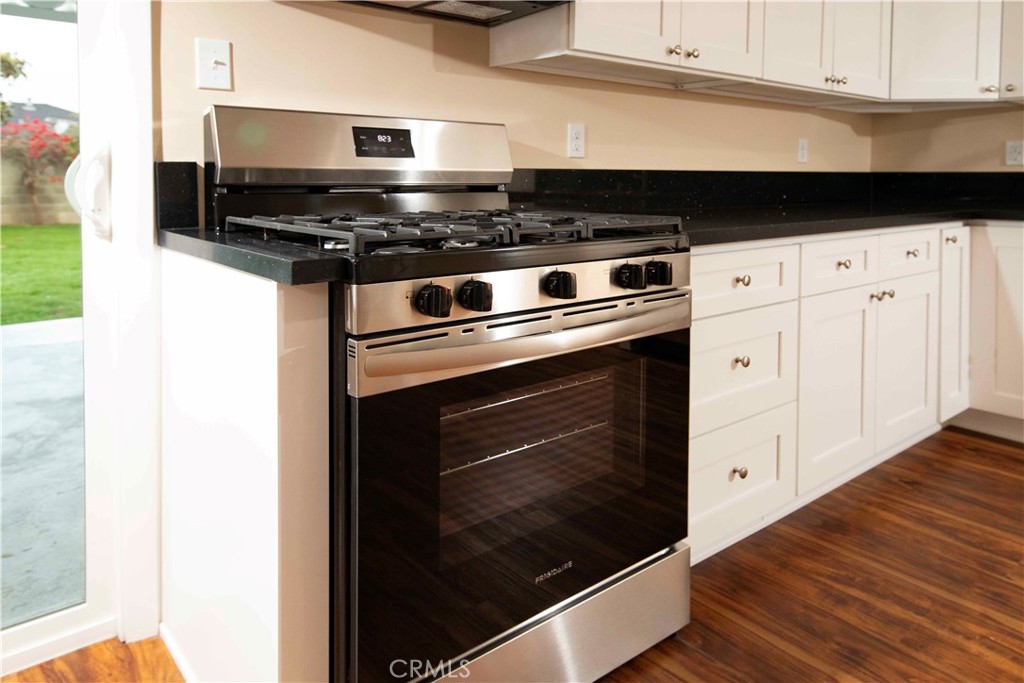 22729 Marbella Avenue Carson, CA 90745 - Photo 48 of 57 a stove top oven sitting inside of a kitchen