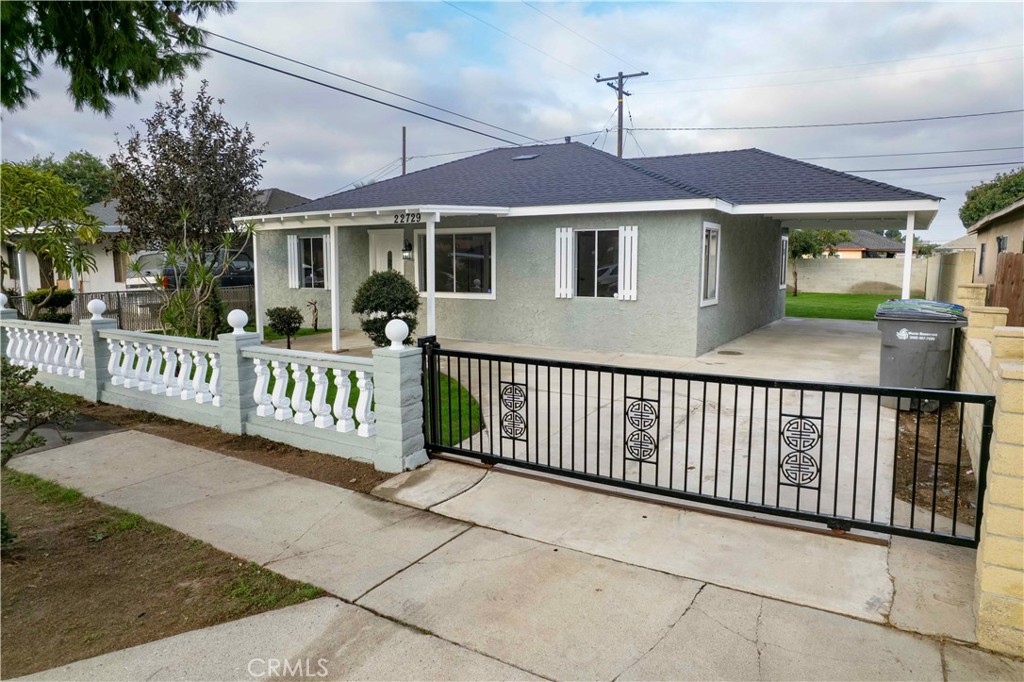22729 Marbella Avenue Carson, CA 90745 - Photo 5 of 57 a view of a house with wooden fence