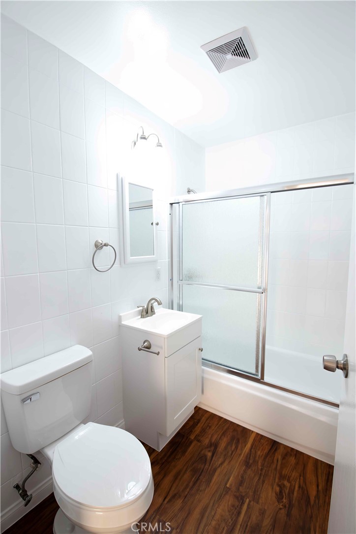 22729 Marbella Avenue Carson, CA 90745 - Photo 53 of 57 a bathroom with a sink a mirror and a toilet