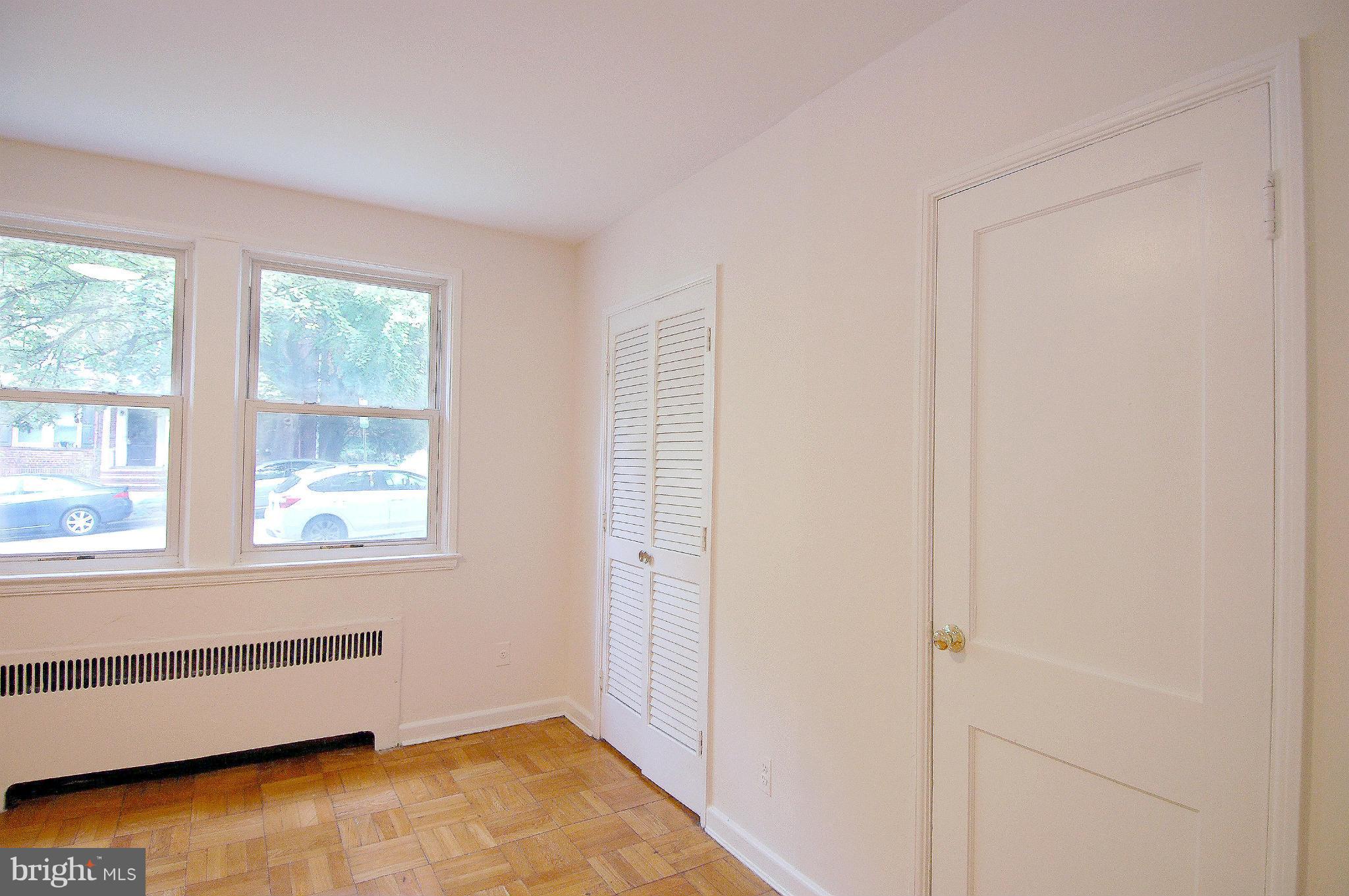 4000 Beecher Street Northwest, Unit 101 Washington, DC 20007 - Photo 15 of 26 a view of an empty room with a window