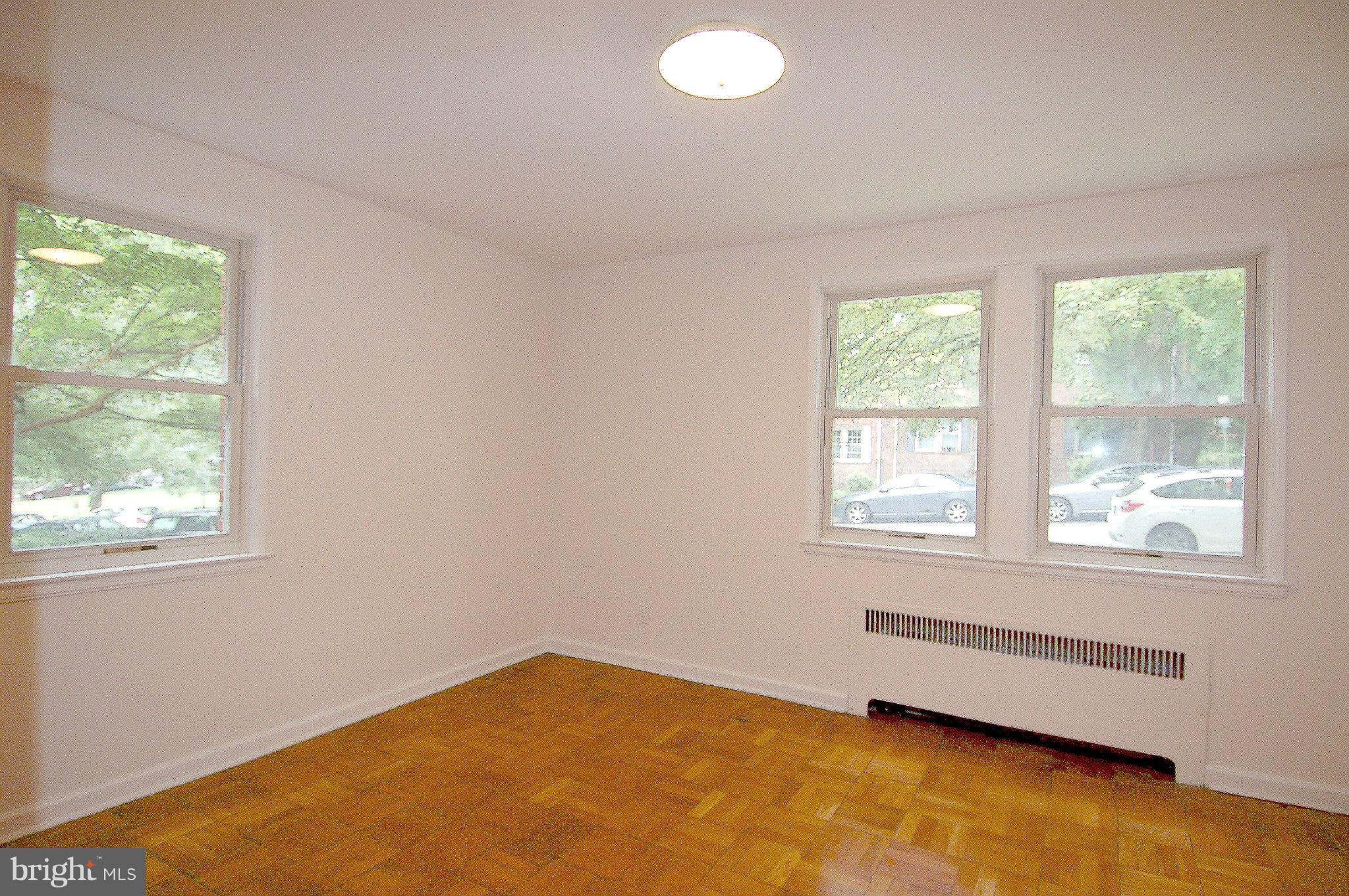 4000 Beecher Street Northwest, Unit 101 Washington, DC 20007 - Photo 16 of 26 a view of an empty room with a window