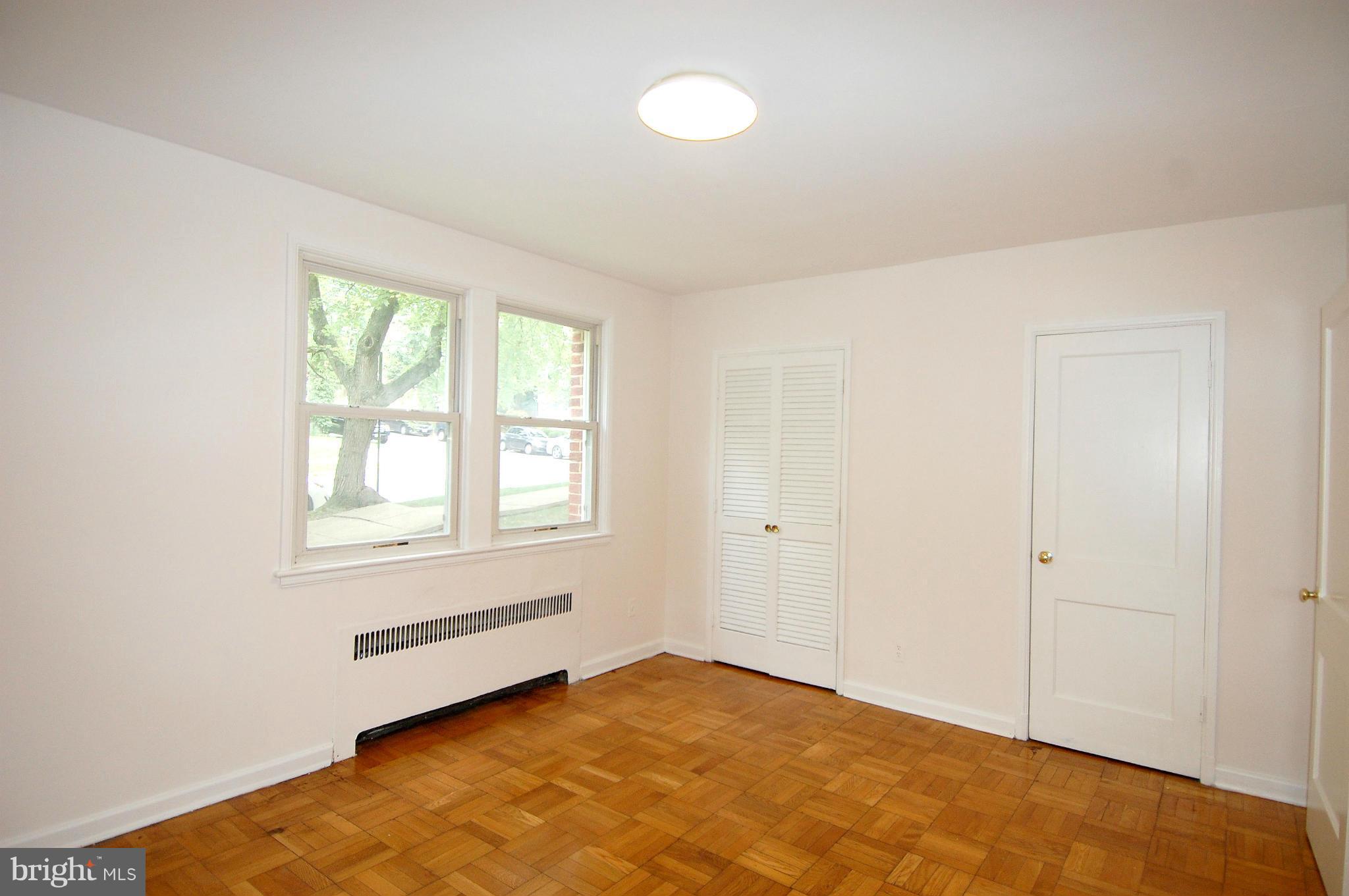 4000 Beecher Street Northwest, Unit 101 Washington, DC 20007 - Photo 19 of 26 an empty room with windows