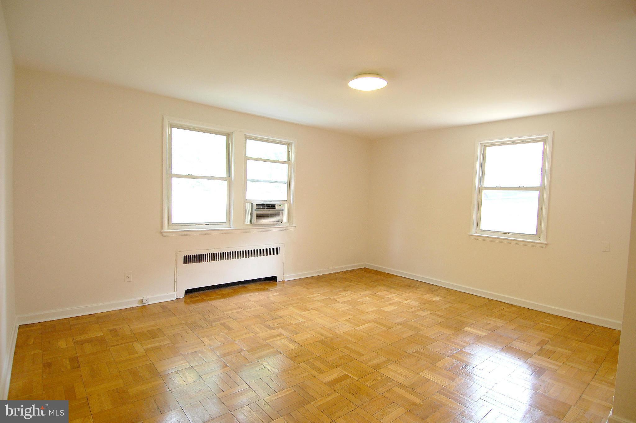 4000 Beecher Street Northwest, Unit 101 Washington, DC 20007 - Photo 4 of 26 a view of an empty room with a window