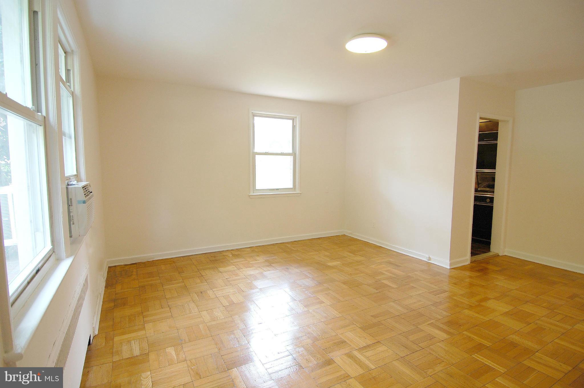 4000 Beecher Street Northwest, Unit 101 Washington, DC 20007 - Photo 5 of 26 a view of an empty room with a window