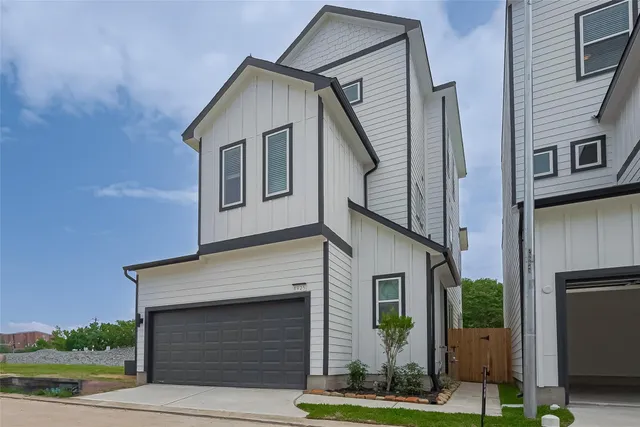 a front view of a house with garage