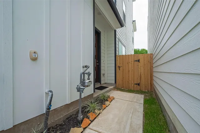 a view of house with a small backyard