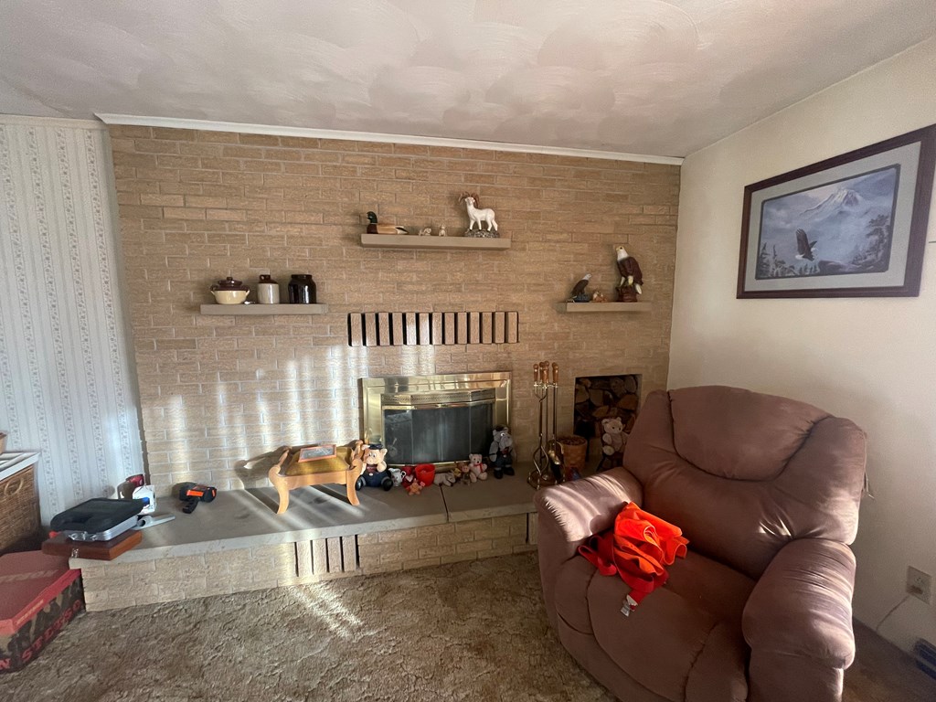 1629 Ringgold Timblin Road Ringgold, PA 15770 - Photo 7 of 24 a living room with furniture a fireplace and a floor to ceiling window