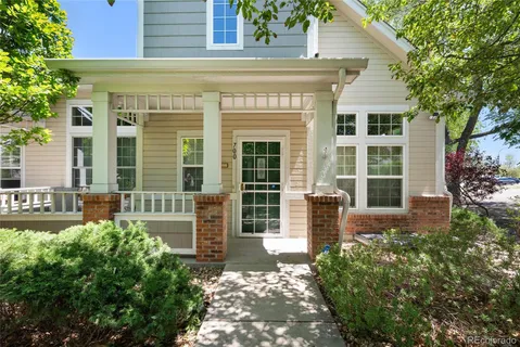 front view of a brick house with a large window