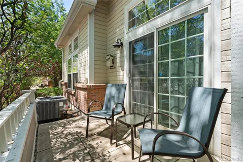 a view of chair and tables in the back yard