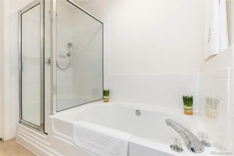 a bathroom with a bathtub and a shower