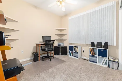 a workspace with furniture and a chandelier
