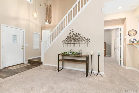 a view of entryway and hall with a front door