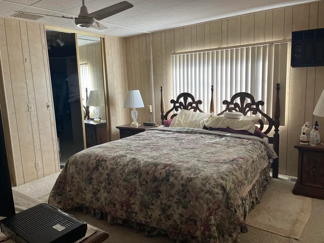 a bedroom with bed and a window