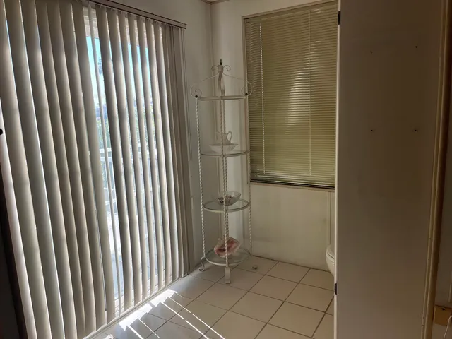 a utility room with dryer washer and a refrigerator