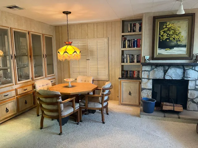 a kitchen with stainless steel appliances granite countertop a stove and cabinets