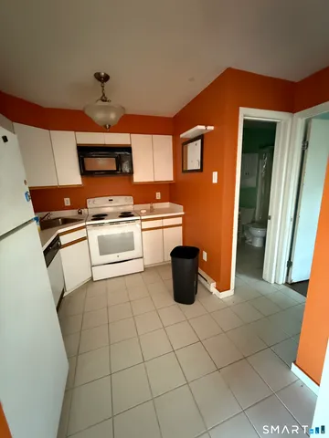 a bathroom with a sink toilet and mirror