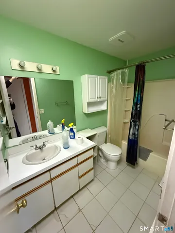 a view of a room with staircase and a window