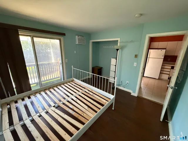 a view of a balcony with wooden floor