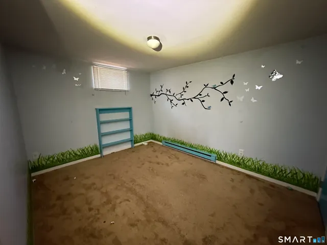 wooden floor and cabinet in an empty room