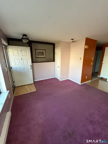 a kitchen with a refrigerator a stove top oven and a sink