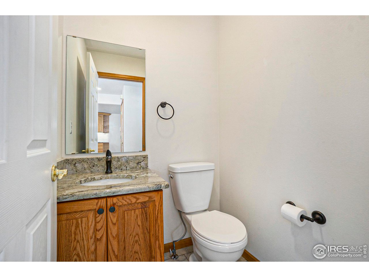 1430 Falcon Ridge Road Eaton, CO 80615 - Photo 15 of 34 Main floor half bath