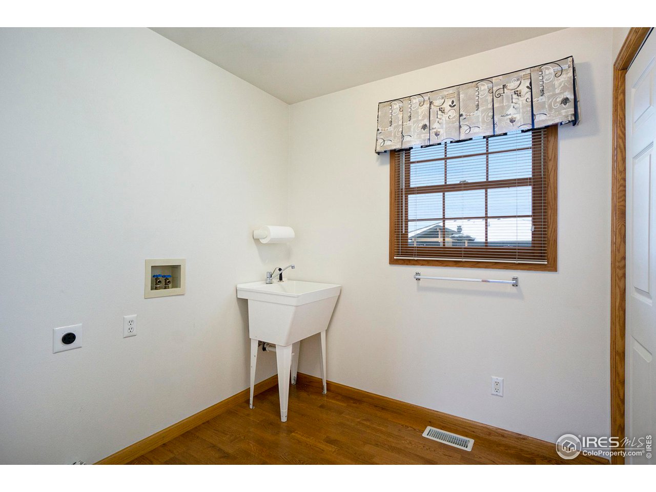 1430 Falcon Ridge Road Eaton, CO 80615 - Photo 16 of 34 Main Floor Laundry
