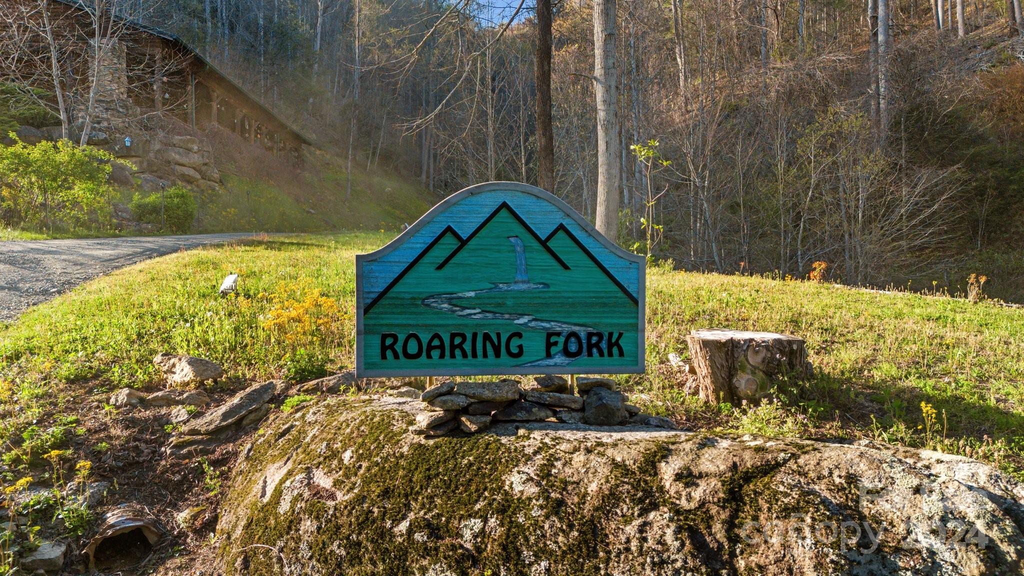 Lot 33 Deer Rock Road Hot Springs, NC 28743 - Photo 15 of 16 a sign that is on a brick wall
