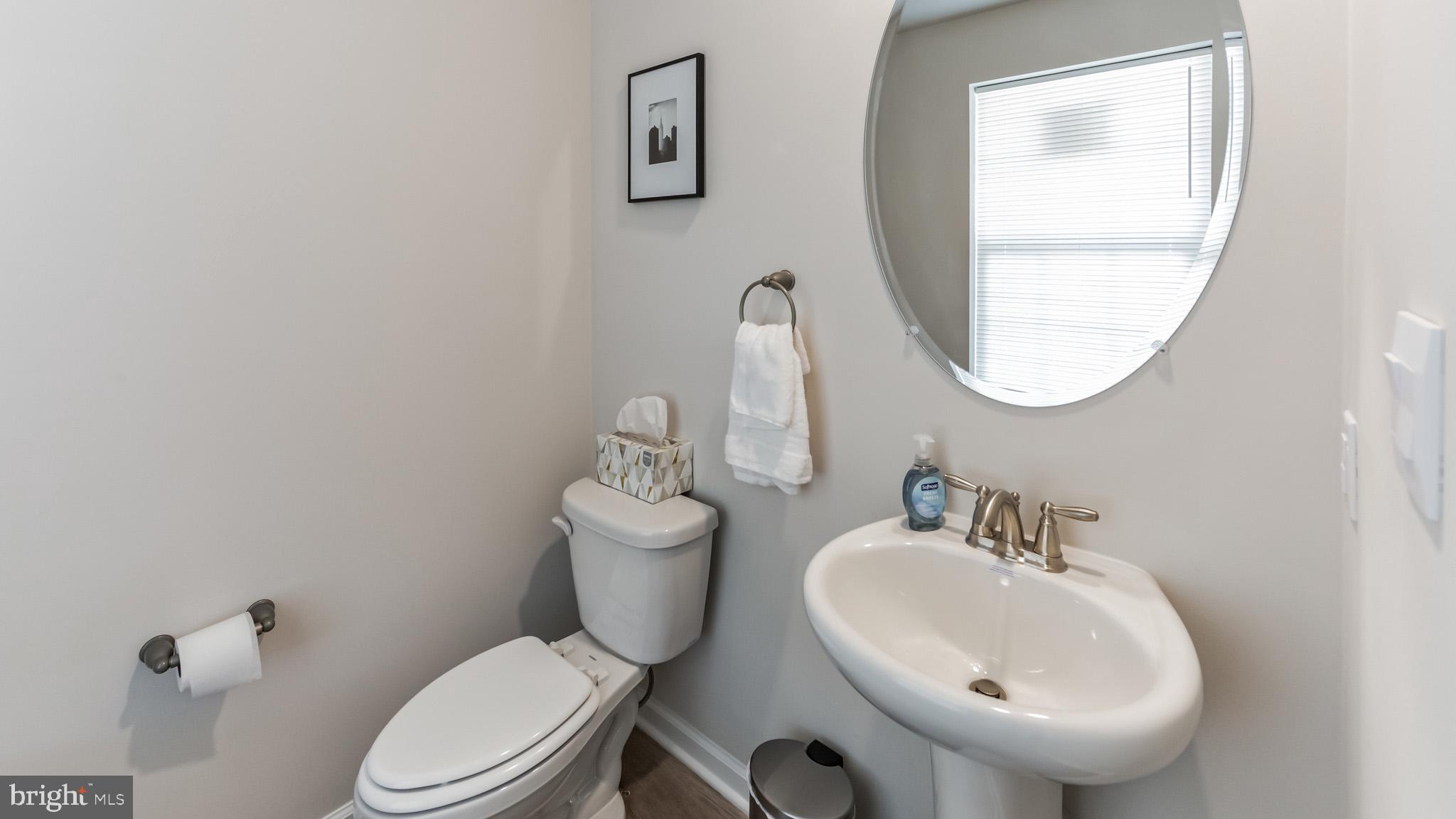 2049 Paperback Way York, PA 17408 - Photo 16 of 28 a bathroom with a toilet a sink and mirror