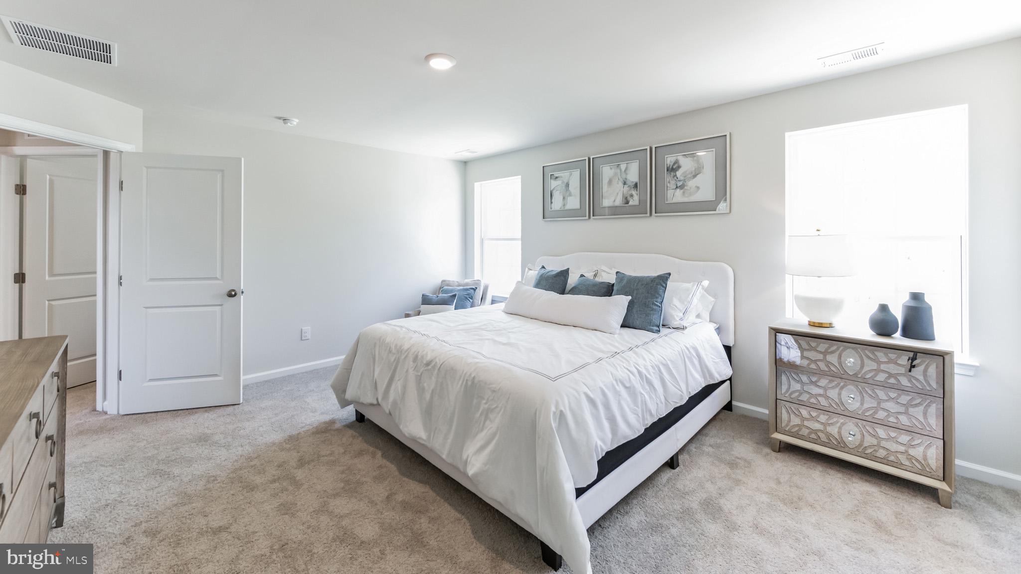 2049 Paperback Way York, PA 17408 - Photo 19 of 28 a bedroom with a bed and a painting on the wall