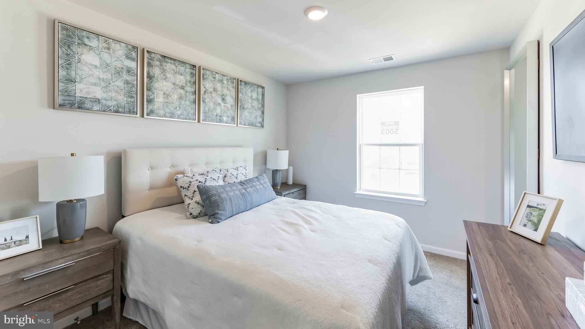 2049 Paperback Way York, PA 17408 - Photo 24 of 28 a bedroom with a bed and wooden floor